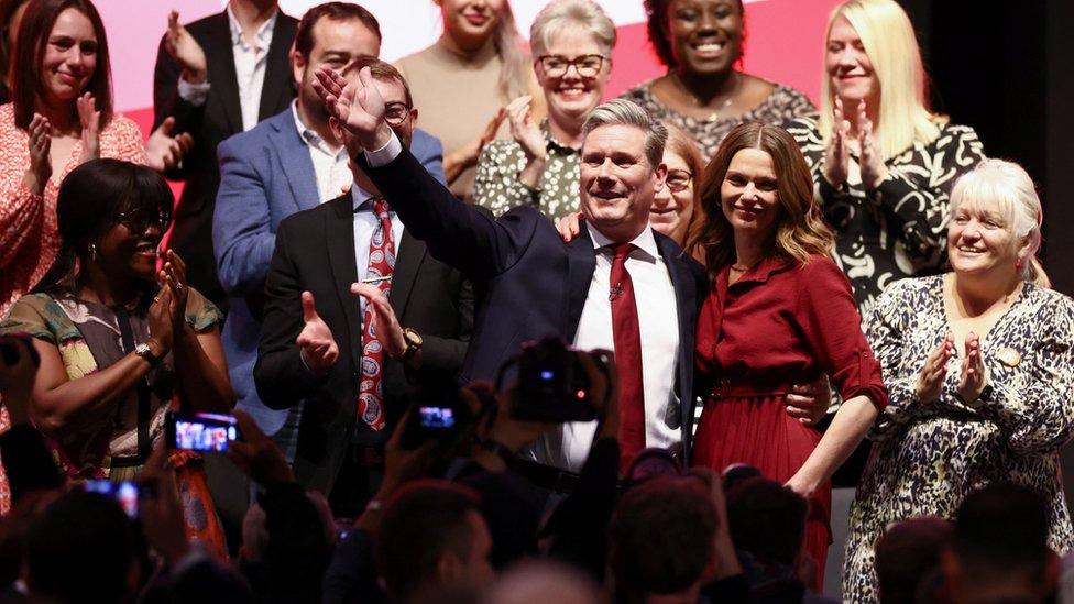 Keir Starmer waves to supporters after his speech at Labour conference