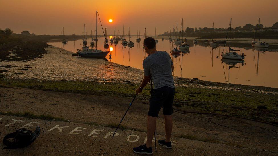 Adam Bennett photographing sunrise in South Woodham Ferrers