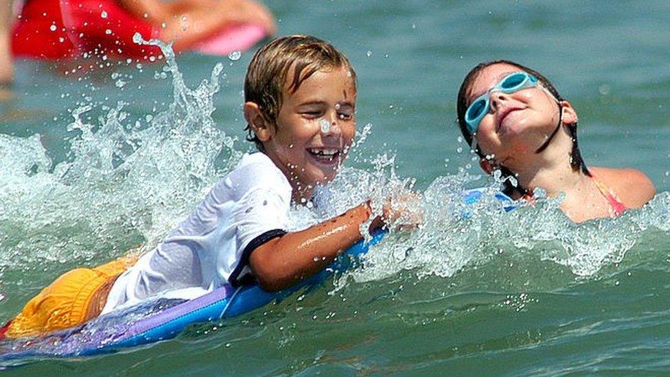 children playing in sea