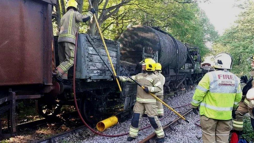 Fire crews working on the damaged vintage train