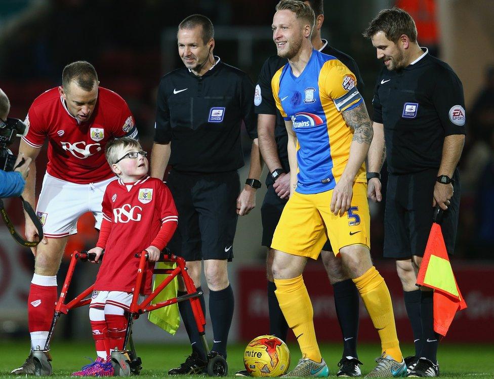 Oskar Pycroft alongside players and officials at Bristol City vs Preston North End