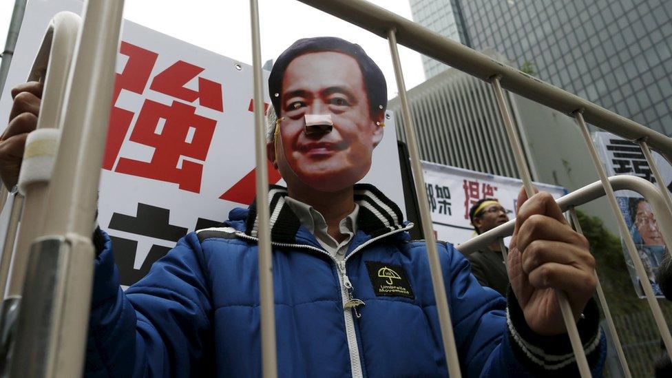 A protester in Hong Kong demonstrates against the disappearance of five people working for a bookshop