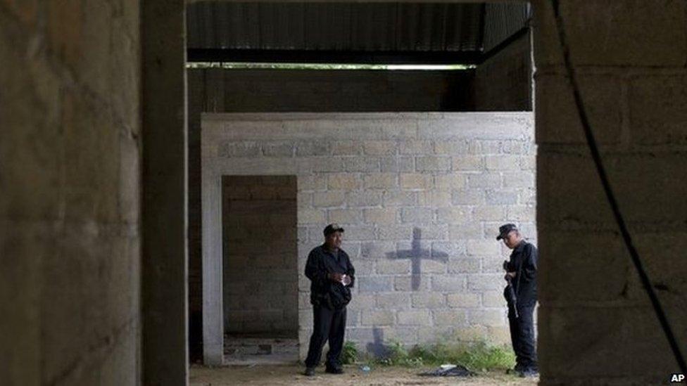 Mexican state police on 3 July 2014 inside a warehouse where a shootout between Mexican soldiers and alleged criminals on the outskirts of the village of San Pedro Limon, in Mexico state, Mexico