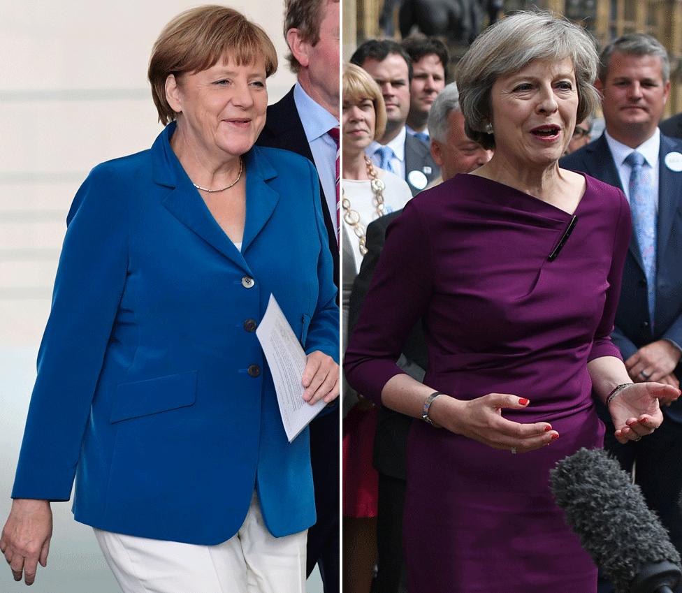 Chancellor Angela Merkel (L) and Conservative leader Theresa May