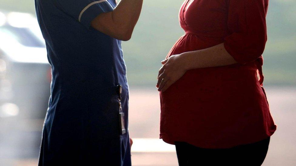 Midwife with pregnant woman