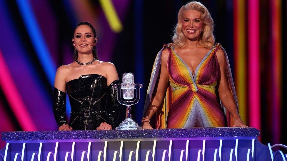 Eurovision hosts Julia Sanina (L) and Hannah Waddingham (R) prepare to announce the countries that will go through to the Grand Final on the stage in the first semi-final during the 67th annual Eurovision Song Contest at the M&S Bank Arena in Liverpool