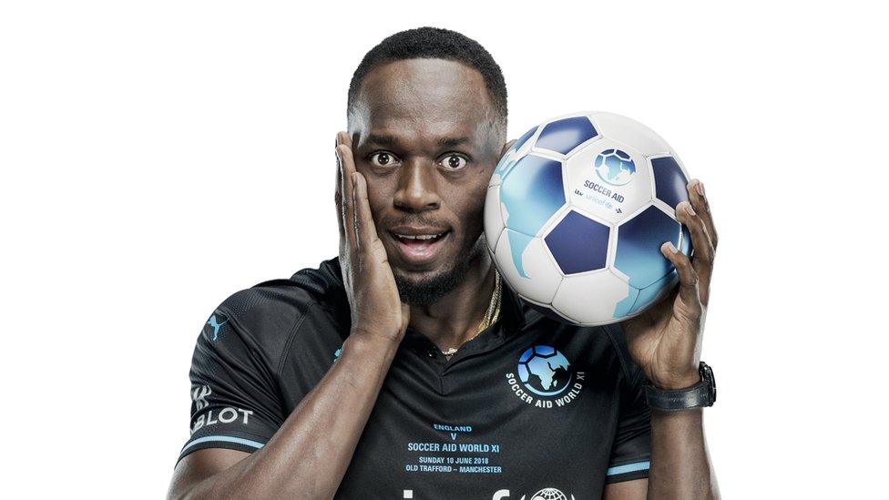 Usain Bolt with a football