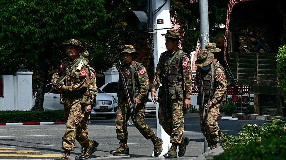 Members of Myanmar's military security force patrol a street during a "silent strike" on the third anniversary of the military coup