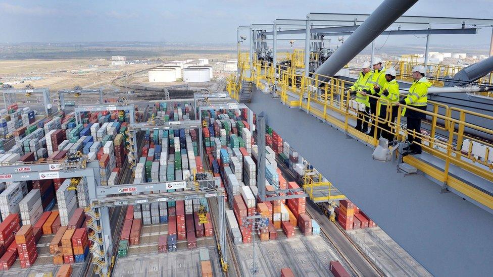 The Duke of Cambridge looks out over container stacks with Lord Hague during a visit to the London Gateway port