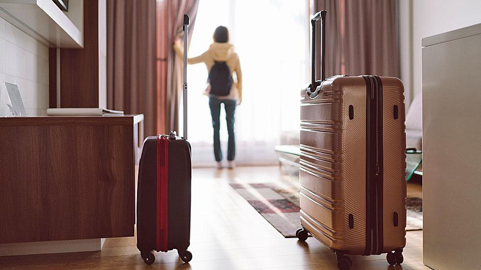 Suitcase in hotel room