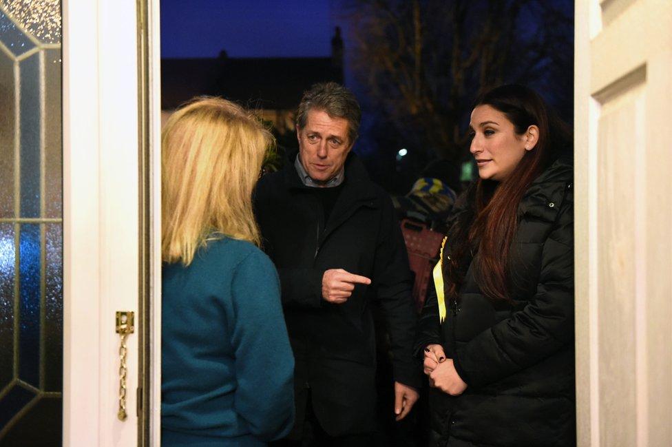 Hugh Grant canvassing with Liberal Democrat candidate for Finchley and Golders Green, Luciana Berger (right), on the General Election campaign trail, 1 December 2019.