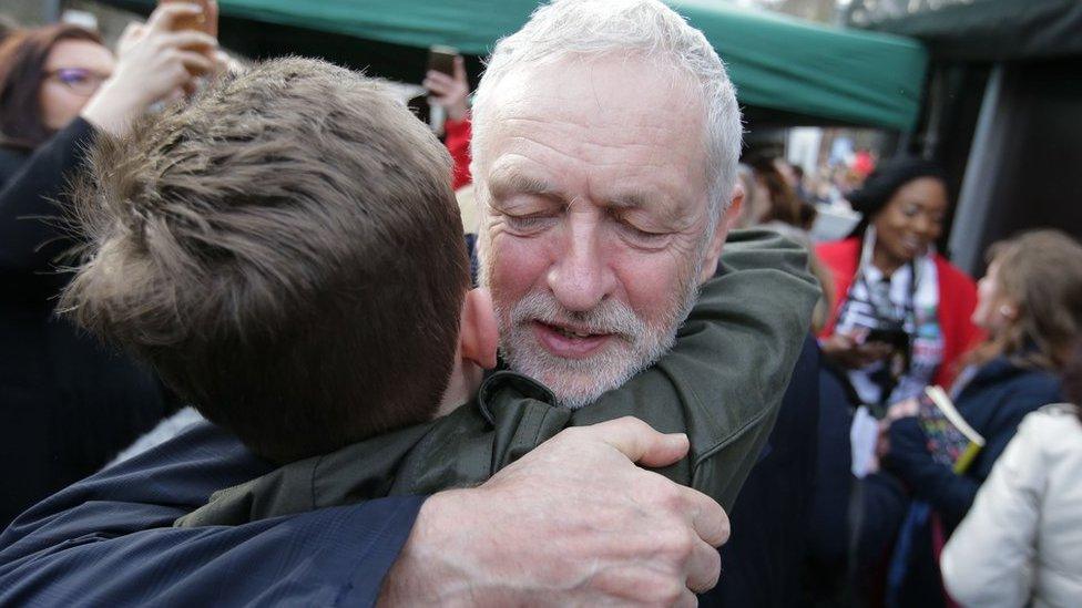 Corbyn hugs supporter