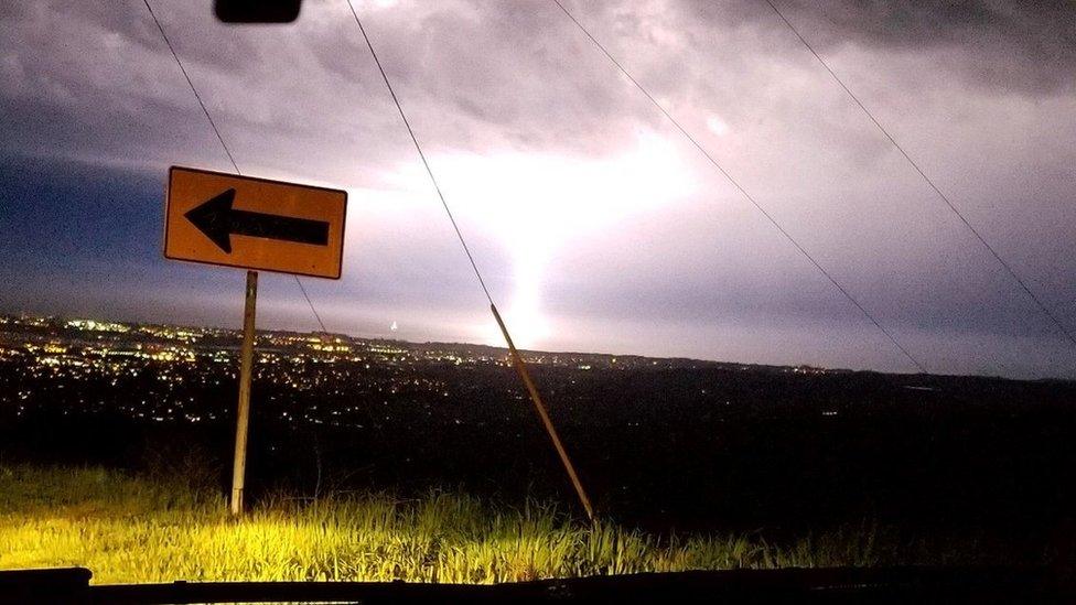 A lightning strike seen through a car windshield