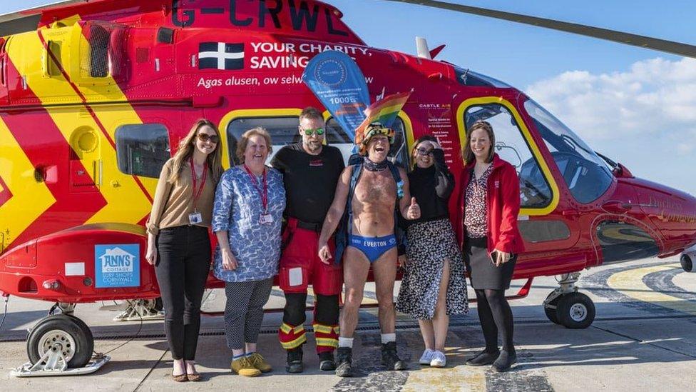 Speedo Mick at helicopter