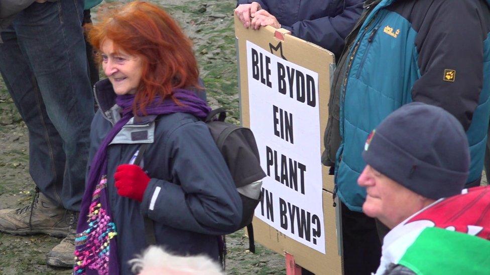 Placard in Welsh asking 'Where will our children live?'