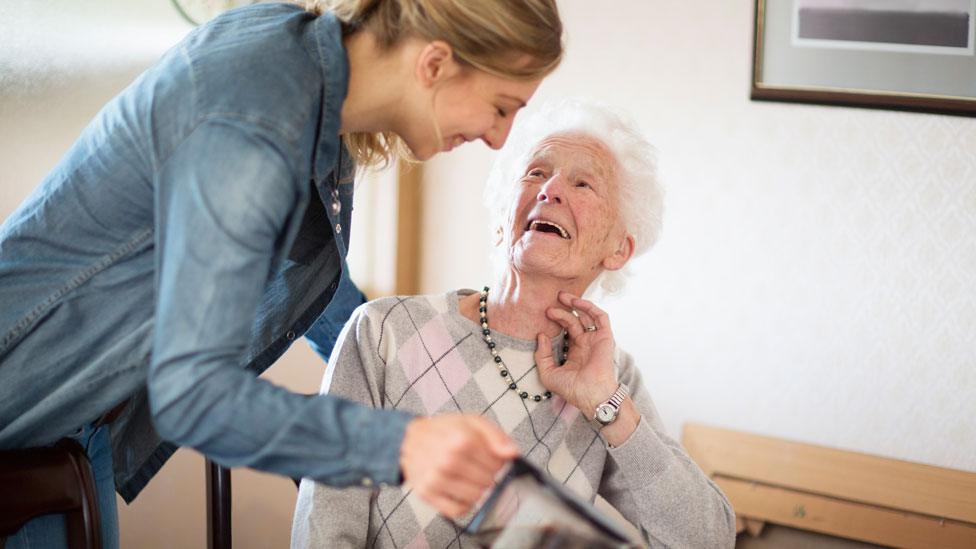 Elderly person being cared for