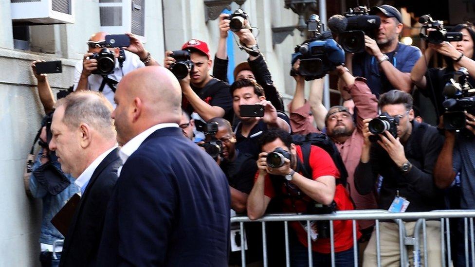 Harvey Weinstein arrives at the police station in New York