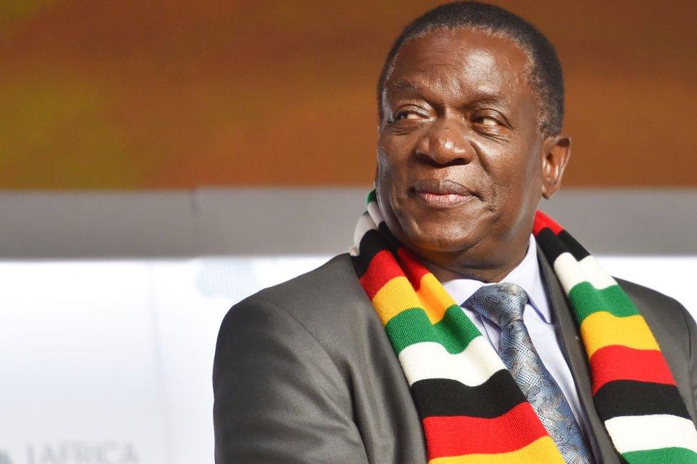 Zimbabwean President Emmerson Mnangagwa in a scarf in the colours of Zimbabwe's flag