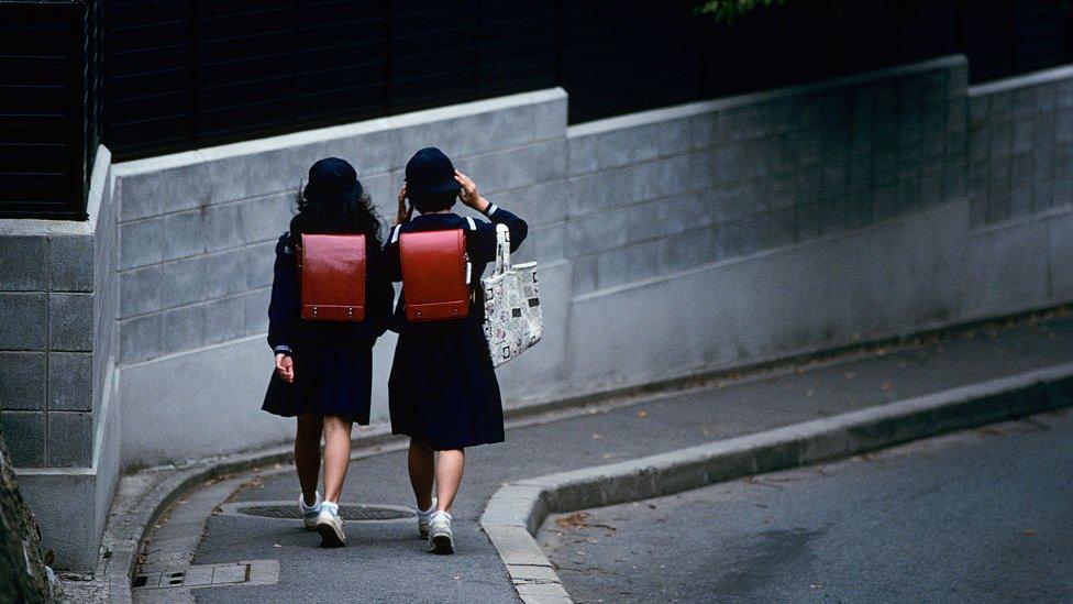 Two girls in school uniform