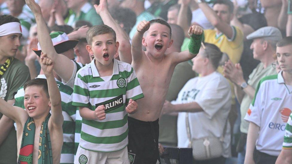 Children celebrating with their arms in the air