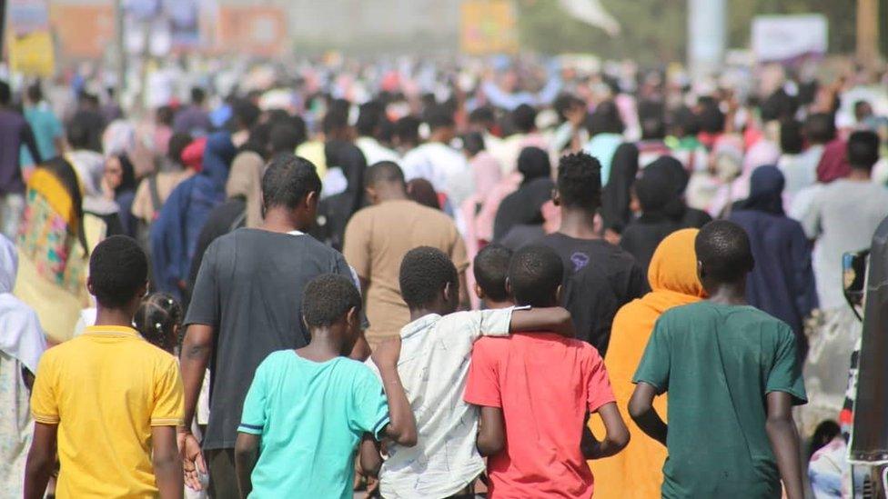 People protest near the army HQ in Khartoum