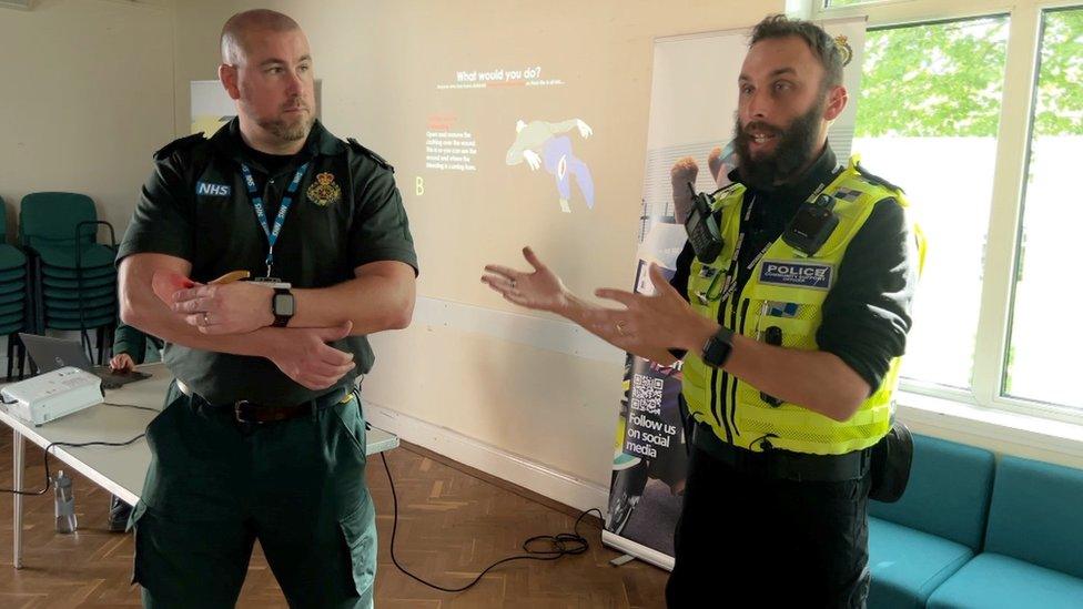 A paramedic and a PCSO delivering the training presentation