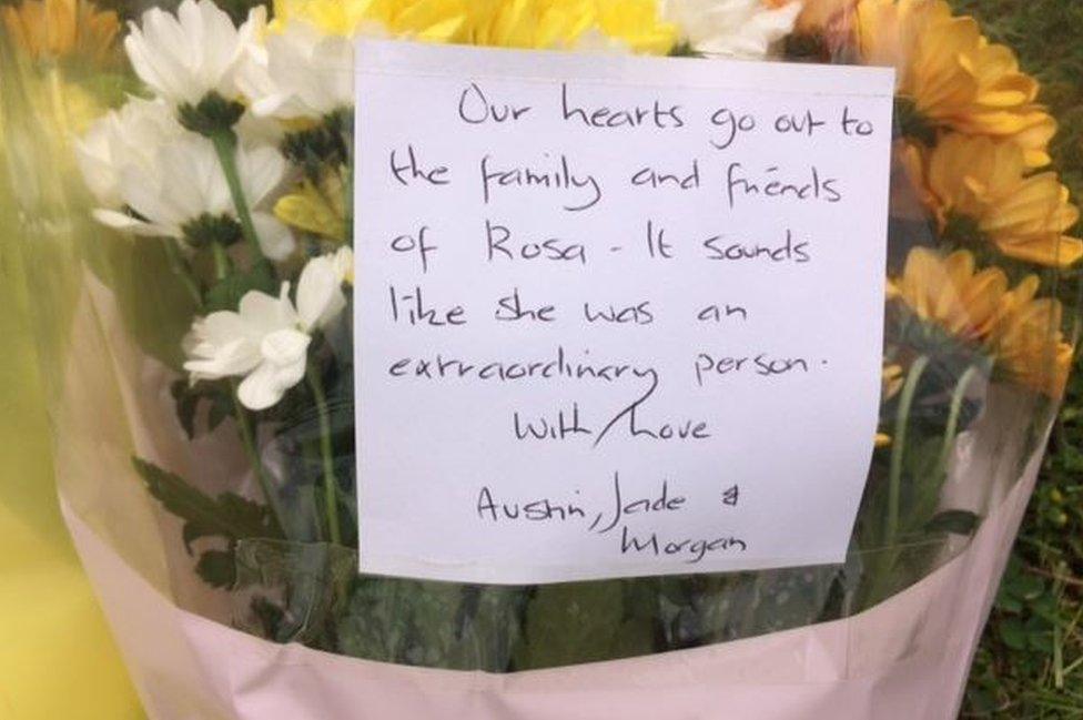 A floral tribute left at the zoo reads: Our hearts go out to the family and friends of Rosa - It sounds like she was an extraordinary person, with Love Austin, Jade & Morgan