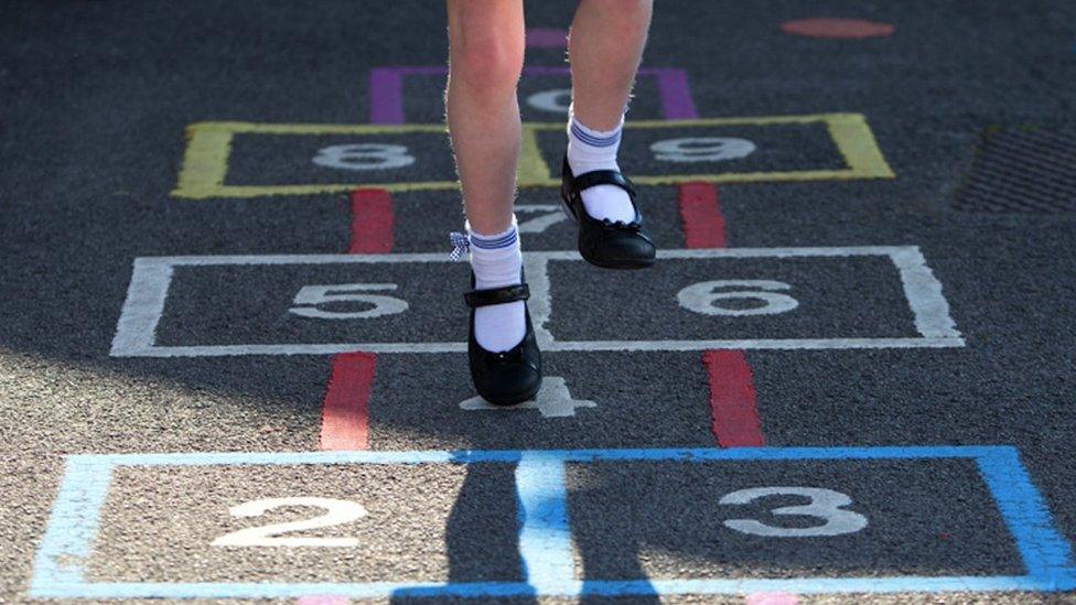 File picture of a girl playing hopscotch