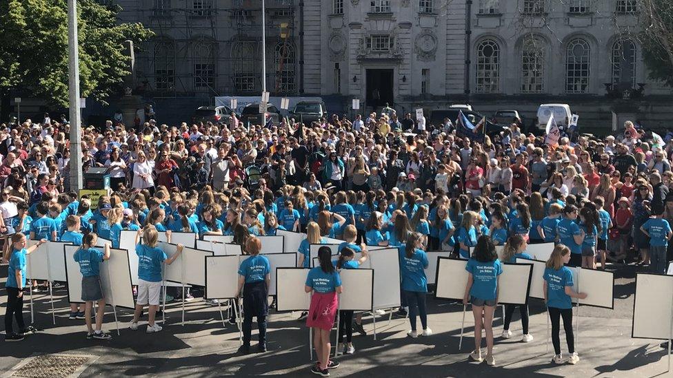 School children perform in front of hundreds of people in Cardiff city centre on Saturday