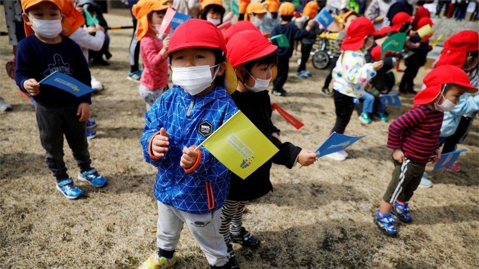 children watching the procession