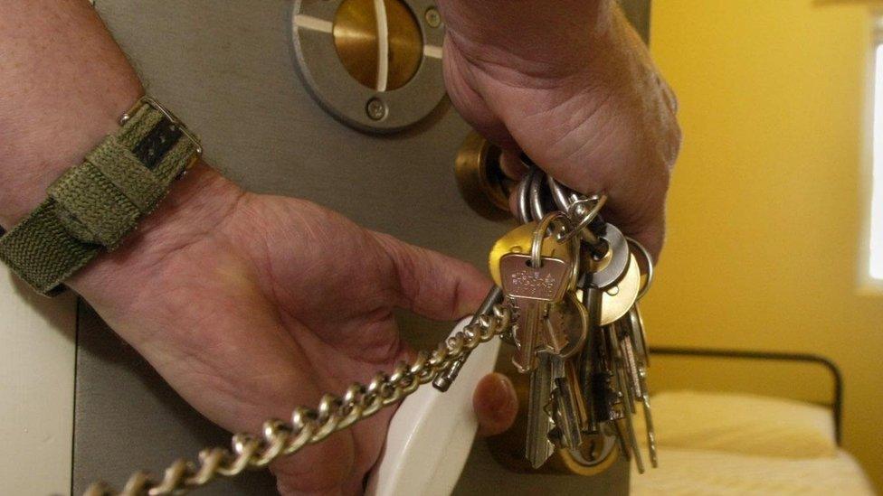 Officer locking cell door