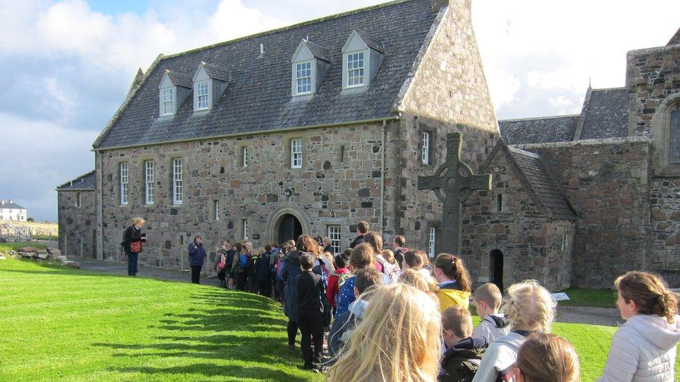 People gather outside the Abbey Church