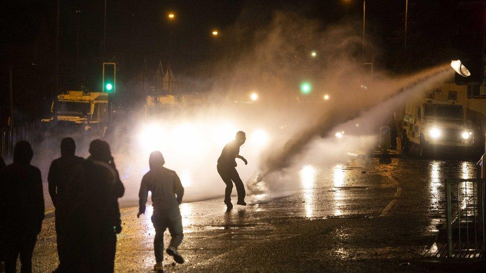 Nationalist youths clashing with Police on the Springfield Road in west Belfast, in Northern Ireland