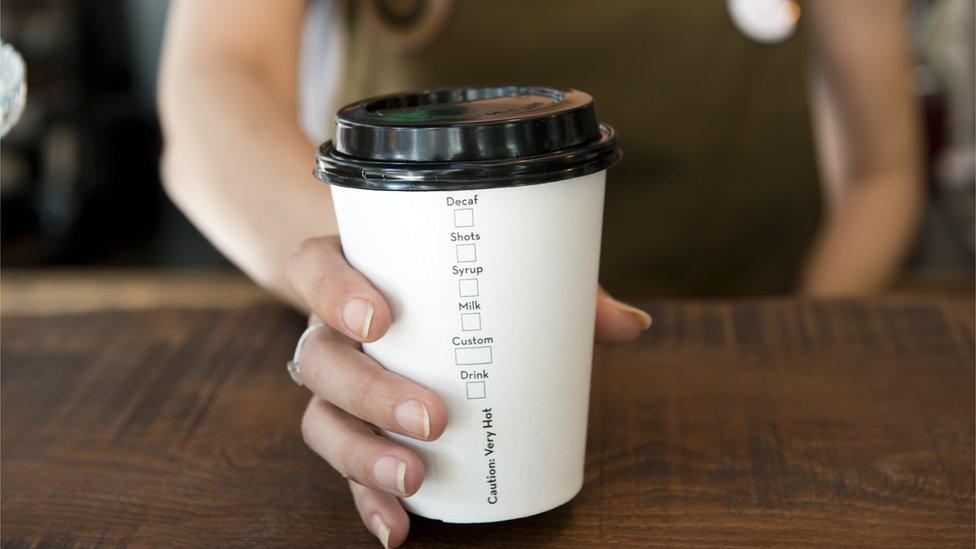 Woman holding cup