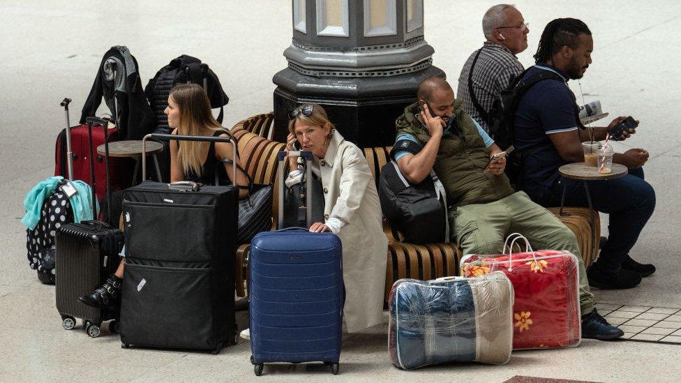 Passengers at London Victoria railway station