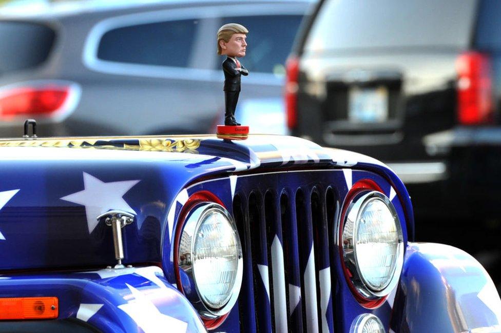 Trump doll on the bonnet of Kobach's car