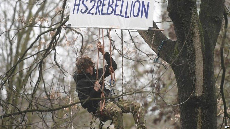 Protestor outside the Euston Square underground station in central London