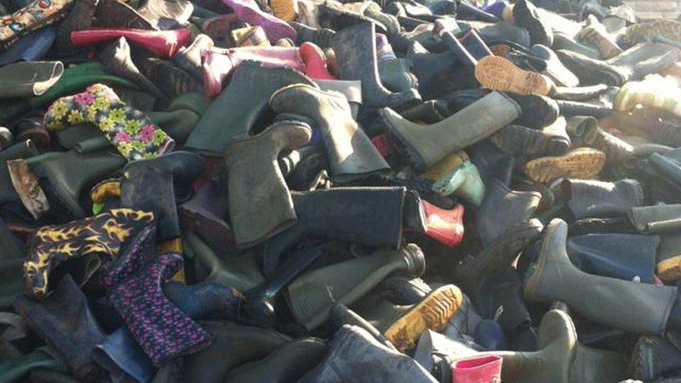 Discarded wellies from Glastonbury Festival