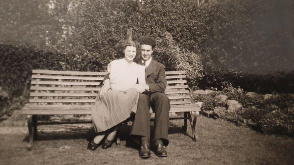 Norma and Bob Beasley on a bench looking very much in love