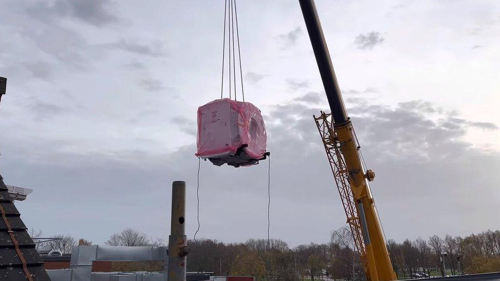 MRI being lowered