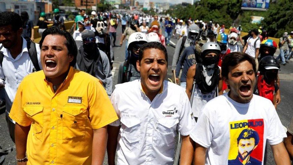 Deputies of the opposition Carlos Paparoni, Jose Manuel Olivares and Juan Andres Mejias shout slogans during a march to state Ombudsman's office in Caracas, Venezuela May 29, 2017.