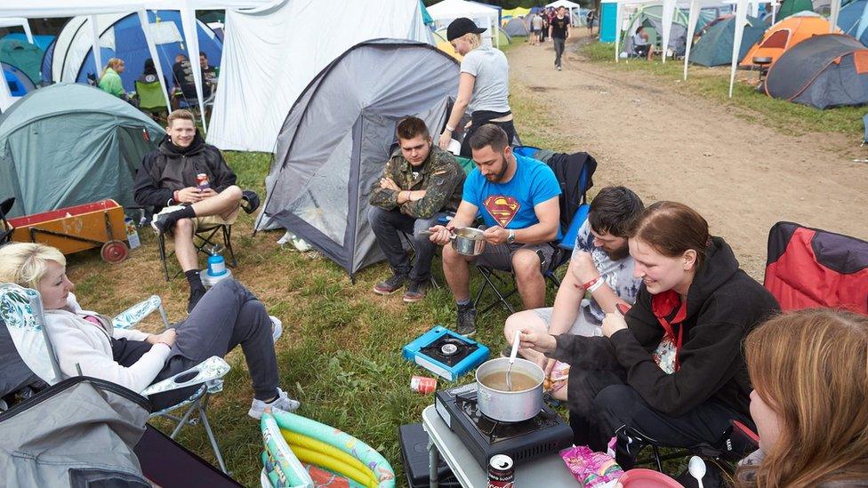 Rock fans breakfast at the campsite of the Rock am Ring music festival in Germany (3 June 2017)