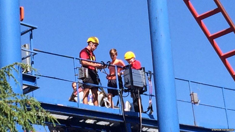 boy on harness on ride