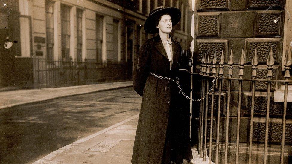 Suffragette chained to railings