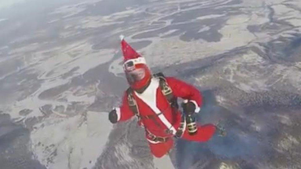 Father Christmas skydives with sparkling wine over Siberia, December 2016