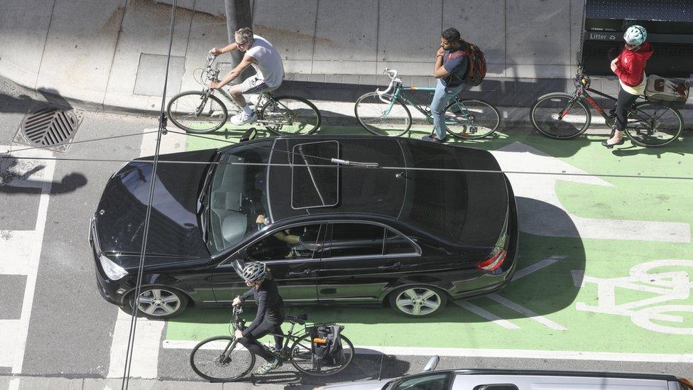 A Toronto intersection with cars and bicycles