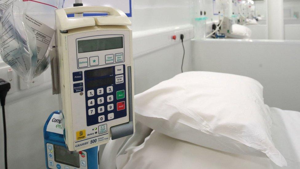 A view of a medical equipment next to a bed