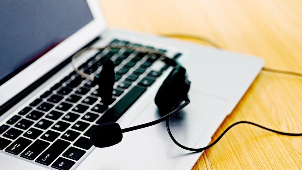 A laptop set up for conference calling