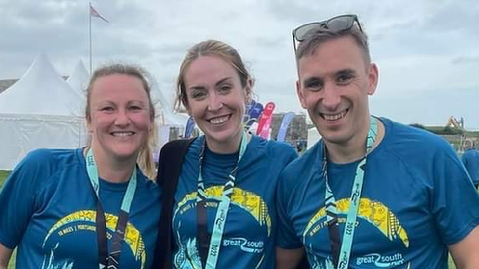 Laura Williams, middle, with her friend Claire and husband John