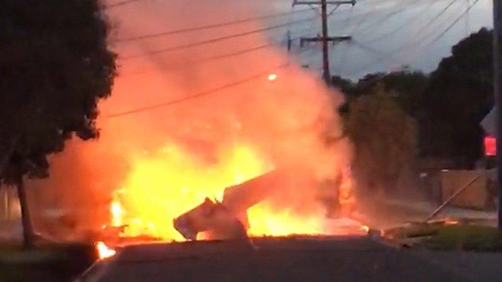 A handout screenshot taken from a supplied video shows a light plane on fire after crashing onto a street in Mordialloc, Melbourne, Victoria, Australia, 08 June 2018